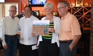 Winner of the Design the Sign contest, Donn Morris, pictured at right.
